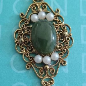 Pendant Necklace with Faux pearls and gold tones has a Jade colored stone